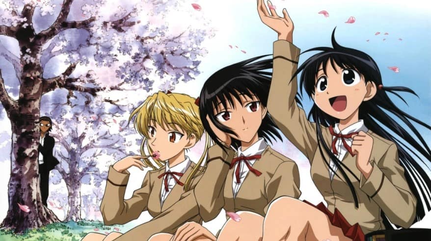Three highschool girls sitting near a cherry blossom tree