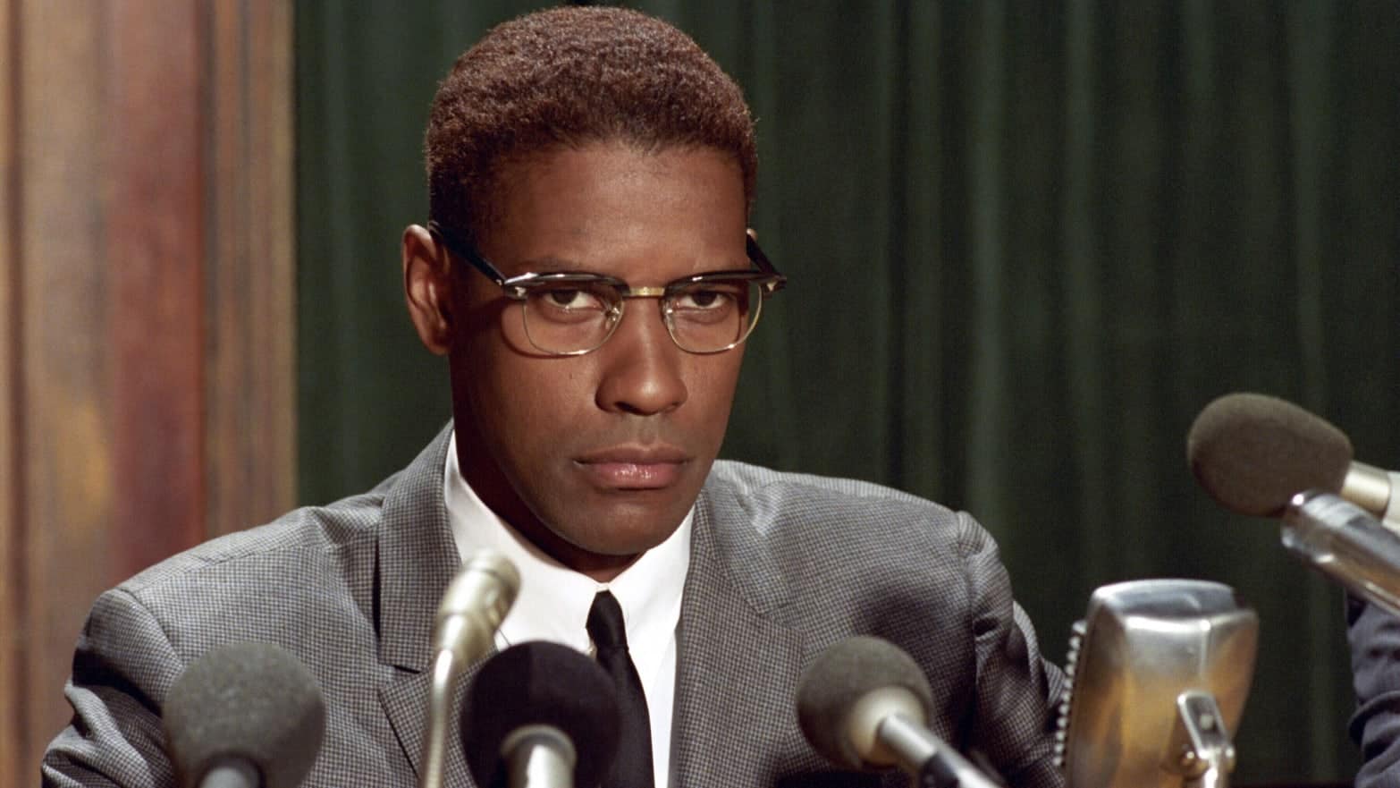 Denzel Washington as Malcolm X in the film (Credits: Warner Bros.)